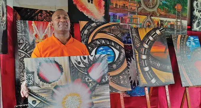 Aisake Qiolele with his drawings. Photo: Wati Talebula