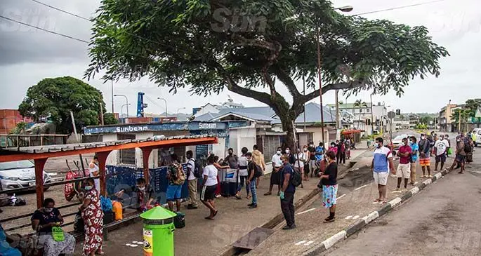 People line up at the Sunbeam Transport Limited ticket booth in Suva as they try to return to their homes in Lautoka on May 9, 2021. Photo: Leon Lord