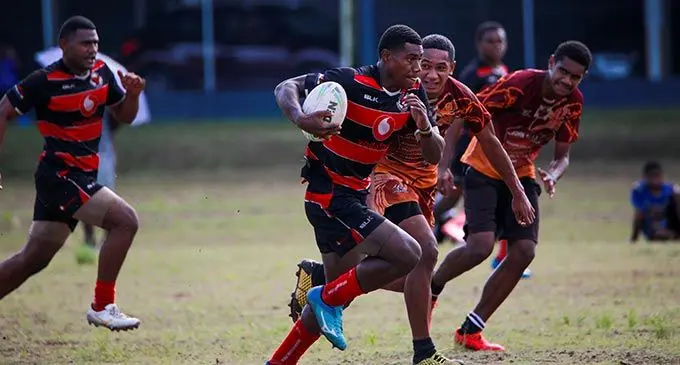 Naitasiri Secondary School’s Emosi Daubitu runs away from a Nabua Secondary School player during their Fiji Secondary Schools Rugby League competition at Marist Brothers High School ground in Flagstaff, Suva, on May 21, 2022. Photo: Leon Lord 