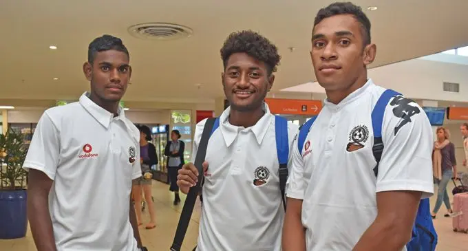 Fiji U19 team Kishan Sami, Ratu Kaliova Dau and Savenaca Baledrokadroka at the Nadi International Airport yesterday. Photo: WAISEA NASOKIA