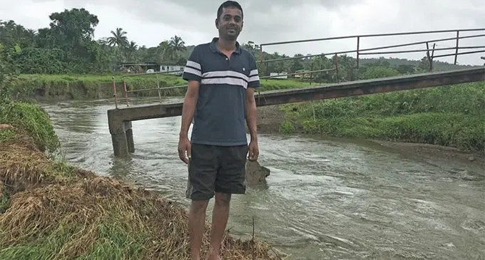 Praneel Sen in front of the damaged bridge at Wainadoi on April 21, 2019. Photo: Neelam Prasad