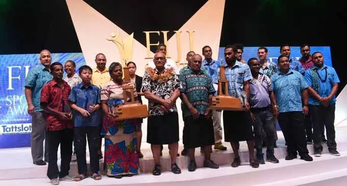 President Major-General (Ret’d) Jioji Konrote (with salusalu) and the Minister for Youth and Sports Laisenia Tuitubou with the winners of the respective categories of the 2017 Fiji Sports Awards at the FMF Gymansium, Suva, on March 3, 2018. Photo: Anasilini Ratuva