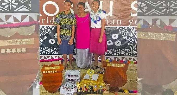 Berlinda Lupe Druava Erasito with her mother and younger brother.  