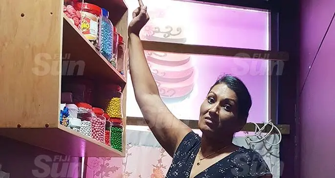 Soma’s Cakes owner, Soma Vilashni points to where the robbers allegedly stole the decoder which stored the shop’s security footage. Photo: Nicolette Chambers