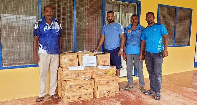 Assistant Minister for Youth and Sports, Alvick Maharaj (second from left) with his team and part of the donation of food packs which were distributed to cyclone affected families in the Macuata Province.