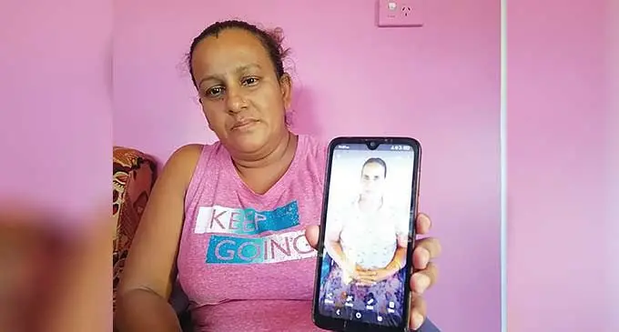 Sangeeta Lata is holding her mother, Savita Prasad’s photo in Nadi. Photo: Mereleki Nai