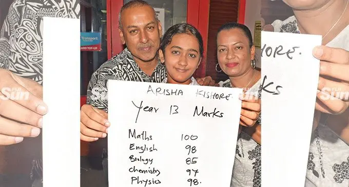 Bhawani Dayal Arya College year 13 student, Arisha Kishore with parents Nawal and Manjula Wati Kishore after scoring 393\400 in year 13 examinination. Photo: Ronald Kumar