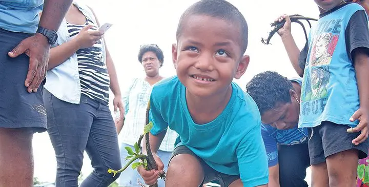 Sailasa Sevaivalu, 5, of Bright Little Ones Children Services plants a mangrove seedling along the Nasese foreshore on July 30, 2019. Photo: Ronald Kumar