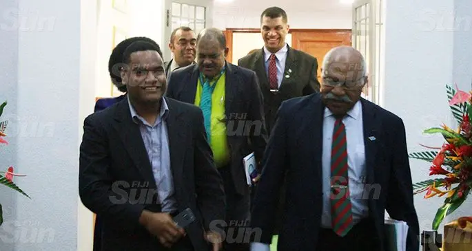 WALKOUT... Opposition leader Sitiveni Rabuka (right) outside Parliament last night after the vote. Photo: Kelera Sovasiga
