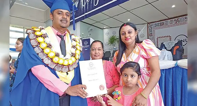 Fiji National University graduate Ashvin Kumar with his mother Kamla Wati, wife Navnita Devi and daughter Nikaantika Kumar. Photo: Shratika Naidu