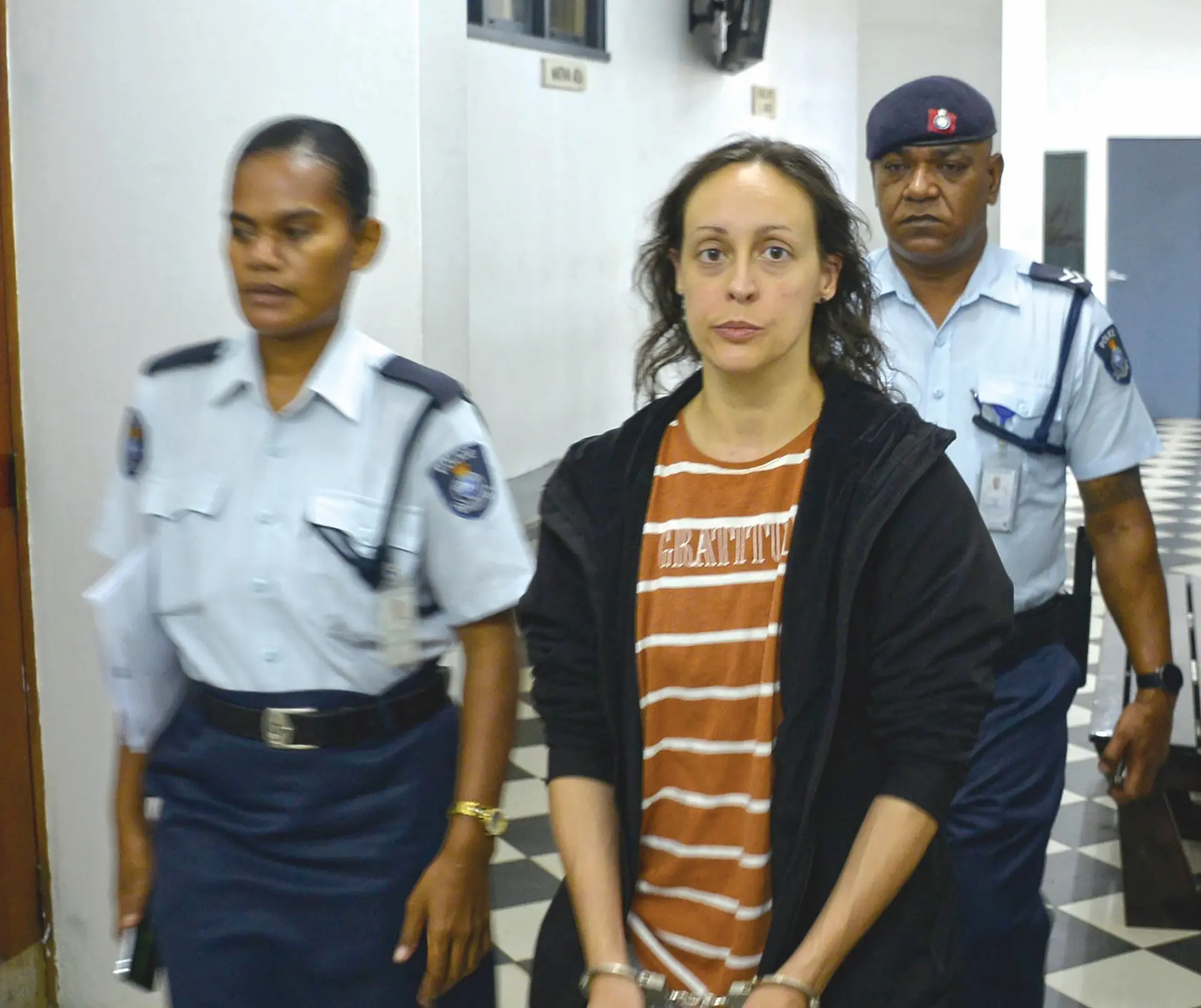 Canadian national Heila Vroyer is escorted to court.