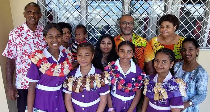 Front from left: Jasper Williams Primary School head girl Salaseini Tanivula, Deputy head girls Claudia Sisaro and Abigail Choy and head girl Nishika Krishna with their family members (from left back row) Iliesa Tanivula, Arieta Tanivula , Aminiasi Goneva,Sharmila Choy,Tagilala Sisaro,Laisani Sisaro and Devika Naidu. Photo: Salote Qalubau