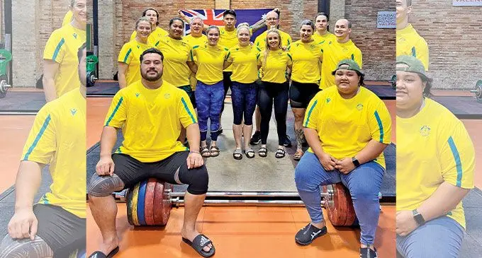 Eileen Cikamatama (standing- front, second from left) with the Australian weightlifters in Valenica, Spain, on July 24, 2022 after completing their final training phase before heading to Birmingham in England. Photo: Weightlifting Australia.
