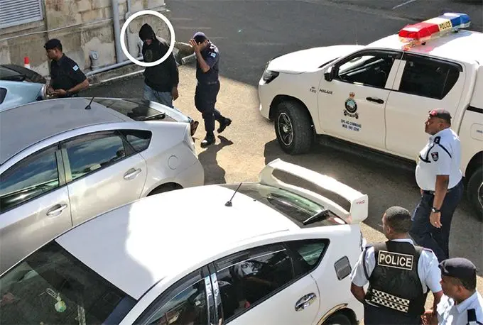 Kiala Marcellino Penakoy Henri Lusaka (wearing a hood),outside the court premises in Suva on August 12, 2019. Photo: Ashna Kumar