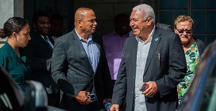 Suspended Commissioner of Police, Sitiveni Qiliho with former Prime Minister Voreqe Bainimarama outside the Suva Magistrates Court on June 19, 2023. Photo: Leon Lord