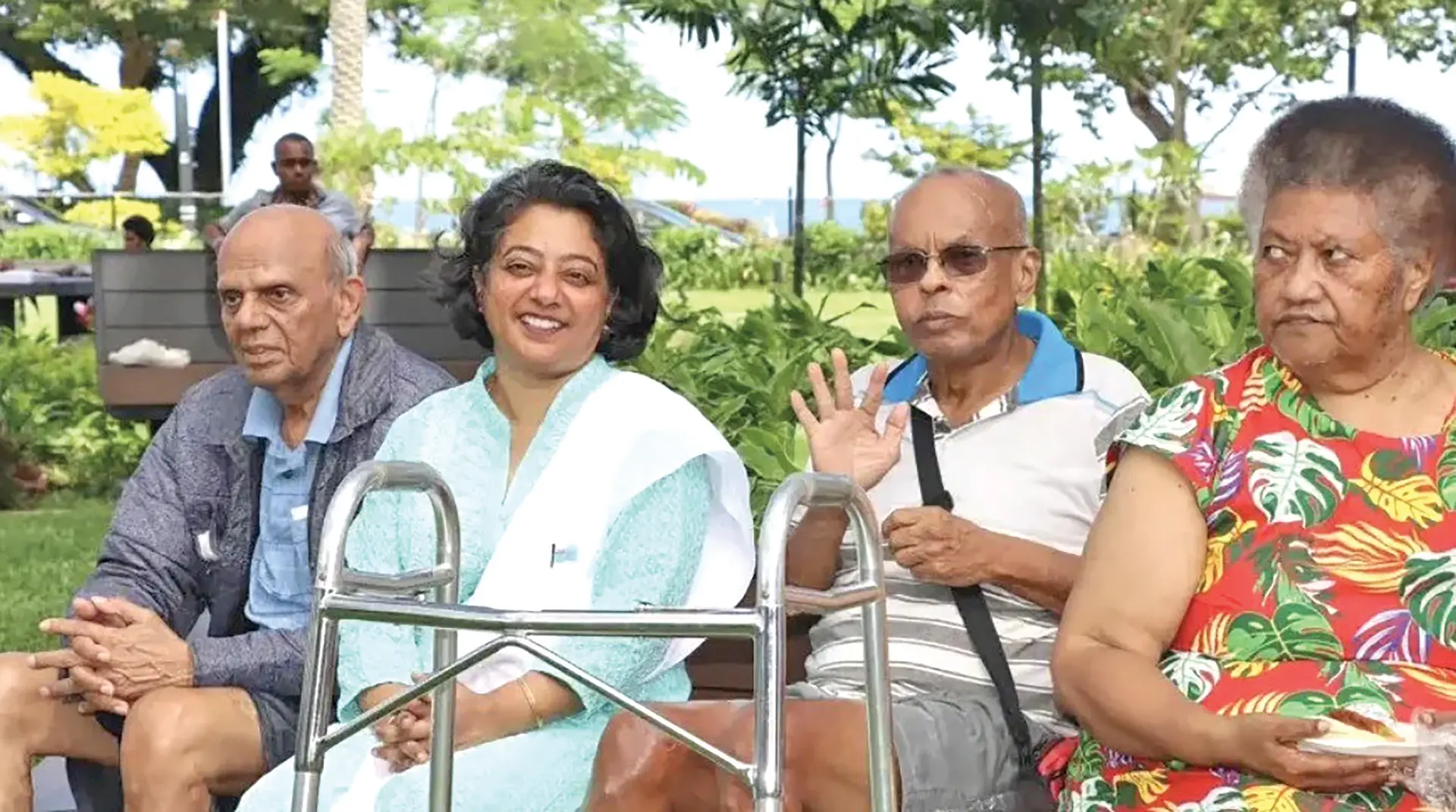 Minister for Women, Children and Social Protection Sashi Kiran with a group of elderly people.