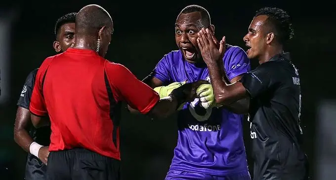 Ba goalkeeper Misiwani Narube (middle) argues with referee Hamilton Siau after awarding a controversial penalty kick to Erakor Golden Star while striker Abbu Zahid (right) tries to calm him down during the OFC Champions League clash at Korman Stadium, Port Vila, Vanuatu on February 26, 2019. Photo: OFC Media