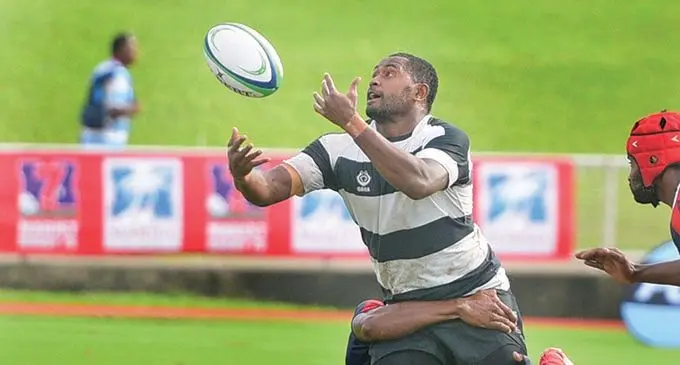 Nawaka’s  Epeli Saukuru loses the ball against Ikavuka during the Fiji Bitter Marist 7s on March 26, 2021. Photo: Ronald Kumar