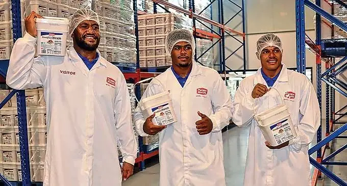 Swire Shipping Fijian Drua players, from left, Emosi Tuqiri, Epeli Waqaicece and Philip Baselala at the Punjas Group factory in Lautoka on December 5, 2023. Photo: Fijian Drua Media