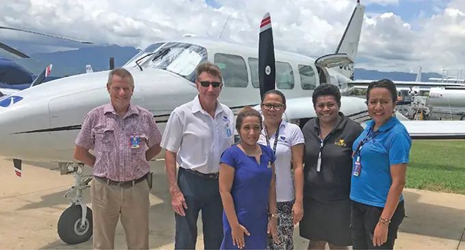 From left: Joyce Aviation Group general manager captain Paul Hilton, Joyce Aviation Group Managing Director Tim Joyce with staff Karishma Bates, Mere Niubalavu, Kini Saukuru and Patricia Tuitubou. Photo: Charles Chambers
