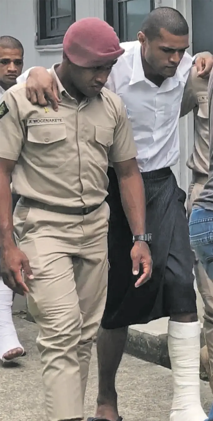Mesulame Waqabaca (in leg cast), outside the Magistrates Court in Suva on January 12, 2019.  Photo: Selita Bolanavanua