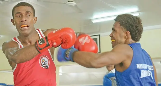 Tevita Dagoya (left) defends against Samuela Waqa in their welterweight semi-final during the TJ’s Golden Gloves championship at Walu Bay, Suva, on February 26, 2021. Waqa  beat Dagoya after referee stopped the contest in te third round. Photo: Ronald Kumar
