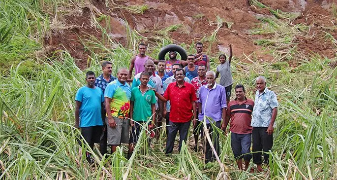 Minister for Youth and Sports Parveen Bala (in red shirt), with Munesh Wargoundar (green t-shirt), with family, community members and officials at Korotale Settlement Ra. Photo: Ministry of Youth and Sports