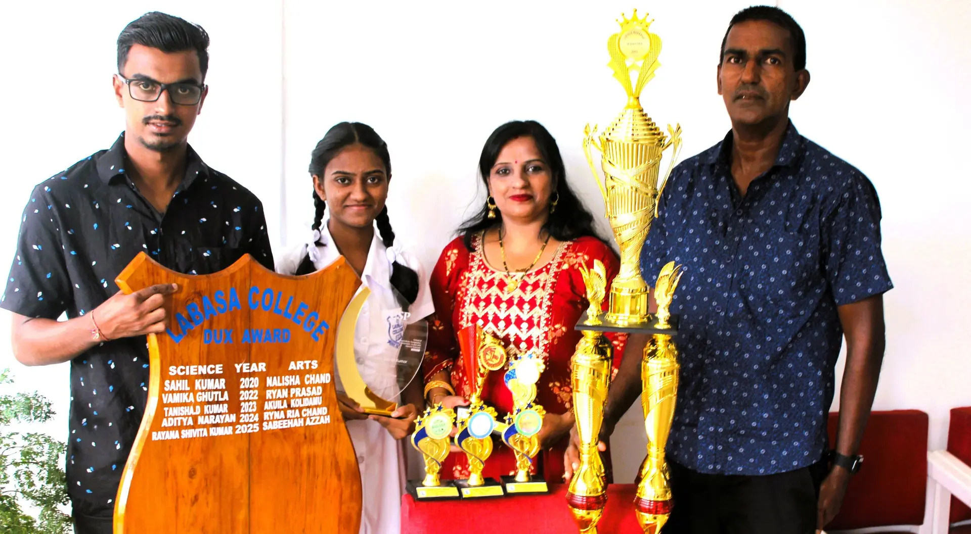 Labasa College dux, Rayana Kumar, with her brother (left), mother, and father poses with her prizes in Labasa Town on December 5, 2025.
