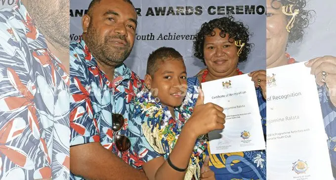 Duke of Edinburgh’s International recognition award recipient, Inoke Ralata, 12, with proud parents Viliame (left), and Karalaini at the Suva Civic Centre on February 2, 2022. Young Inoke incorporated his hobby of baking into a business to support his family.            		       					    			Photo: Ronald Kumar