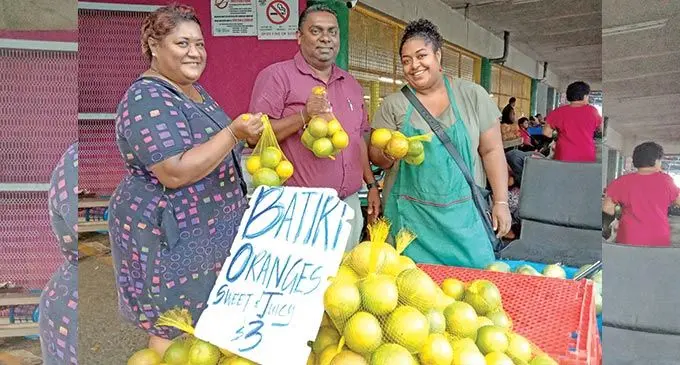 From left: Market vendor Asinate Ginigini , Food Processors (Fiji) Limited sales manager Rohit Prasad and market vendor Roselyn Daveta. Photo: Laiseana Nasiga