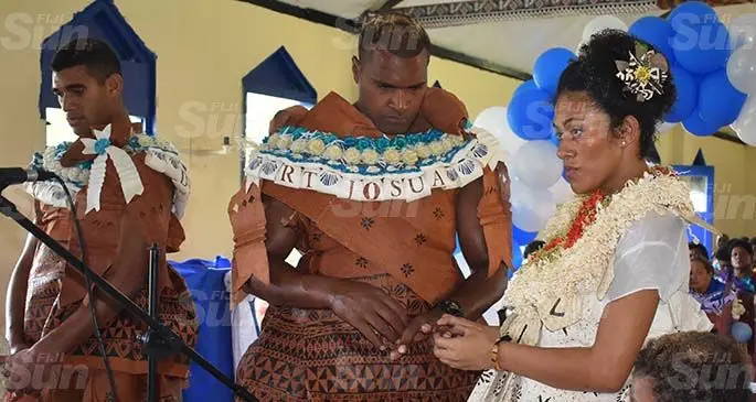 Fiji Airways Fijian 7s star Josua Vakurunabili and his bride Sereima Taiti at Vatukarasa, Nadroga, on March 20, 2020. His best man is Fiji Airways Fijian 7s teammate and  captain, Meli Derenalagi (left).  Photo: Mereleki Nai