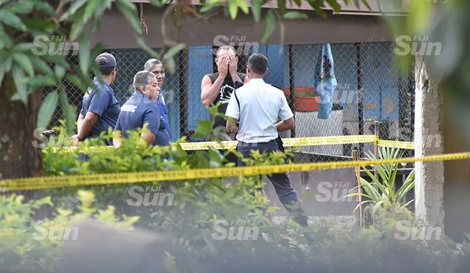 Police officers question neighbours outside the house of the late Kumar family in Legalega, Nadi, on August 29, 2019. Photos: Waisea Nasokia