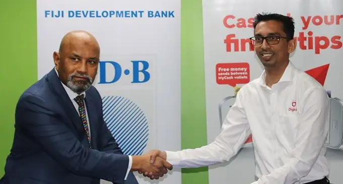 Fiji Development Bank chief executive officer Saud Minam (left), and Digicel Fiji chief executive officer Farid Mohammed after sealing the agreement on December 1, 2021. Photo: Fiji Development Bank