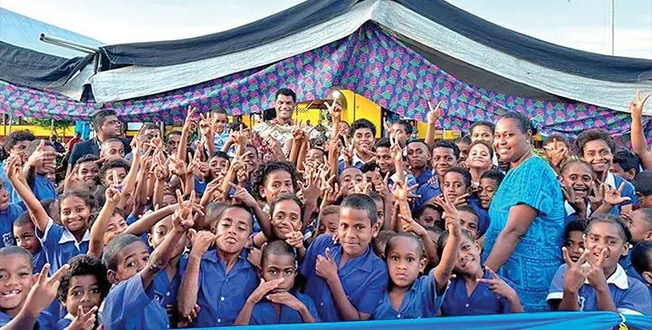 Minister for Education Aseri Radrodro with students of Valelawa Primary School in Macuata.
