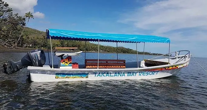Guests of the resort travel in an open boat to Moon Reef. Photo: Takalana Bay Resort