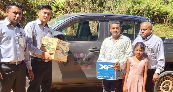 Donors on the right handed out food pack assistance to residents at the Dreketi lockdown area in Macuata on May 5, 2020