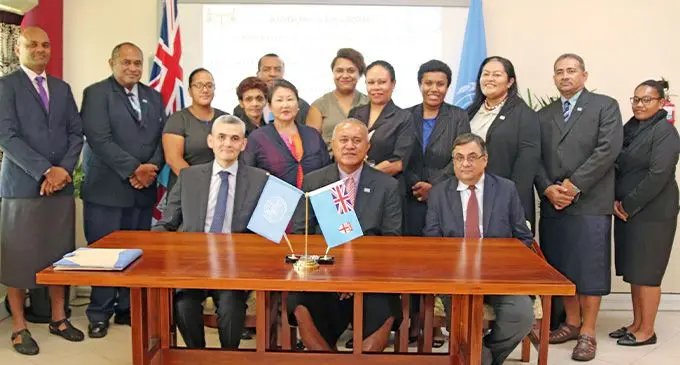 UNDP Resident Representative Bakhodir Burkhanov and the Permanent Secretary for Foreign Affairs Ioane Naivalurua.