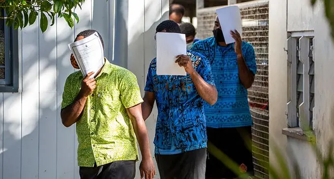 Three of the four men at the Suva Magistrates court.