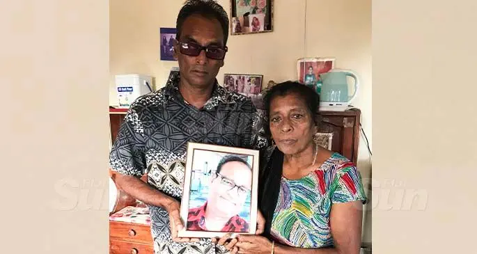 Sudesh Singh and his mother Parvati showing Vinay Singh’s photo inside their Vunivau home in Labasa on July 28,2020.. Photo: Shratika Naidu