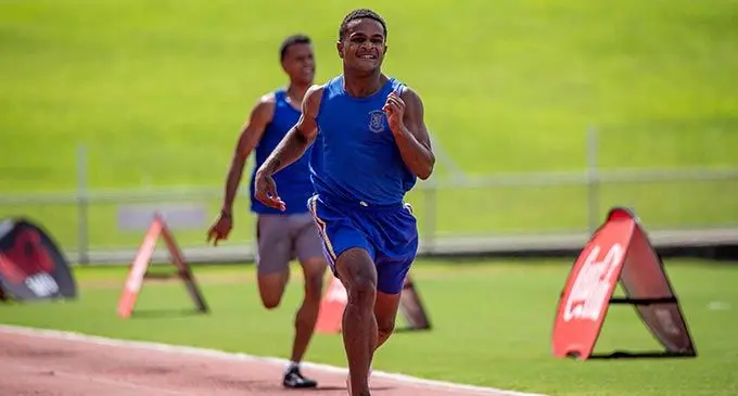 Suva Grammar School sprint king Tevita Mocekinasau wins the senior boys 200m event during the school inter house at the ANZ Stadium, Suva, today. Photo: Leon Lord