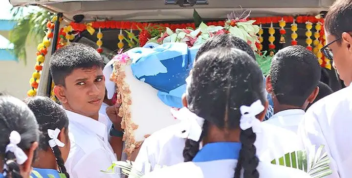 The body of the Year 12 student being carried around the school premises in Ba.