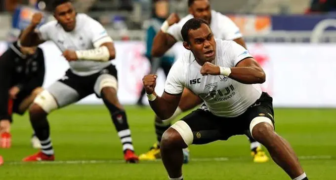 Fijian players are overcome with emotion after a historic first rugby test win over France. 