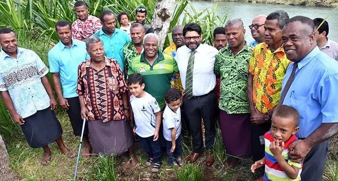 Attorney-General Aiyaz Sayed-Khaiyum with Naveicovatu villagers of Tailevu and his sons, Ibrahim and Idris, on September 10, 2019 following the launch of the Global Commission and Adaptation Flagship Report.   Photo: Ronald Kumar
