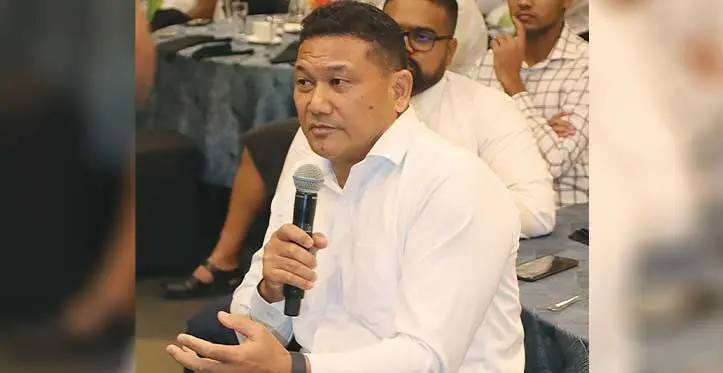 Jerome Kado, a senior partner at the PricewaterhouseCoopers, speaks at a business breakfast at the Grand Pacific Hotel last week.