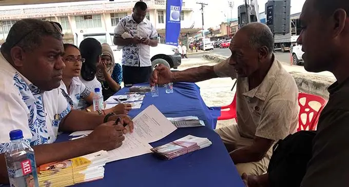 Fiji Development Bank Labasa Branch Manager Tevita Turagatani (left) with 70 year-old Solomone  Senikauciri and Mosese Betekasa of Batiri, Seaqaqa, during the FDB talanoa session at the old MH site on May 4, 2019. Photo: Laisa Lui 