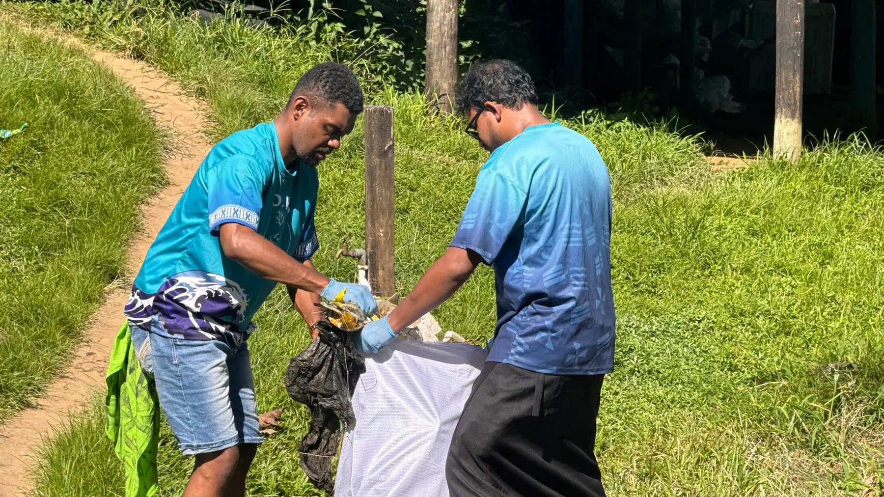 Ratu Anare Davetanivalu (right) with a collegue during the Pacific Ocean Litter Project volunteer programme in Vanuakula Village, Naitasiri on May 12, 2026.