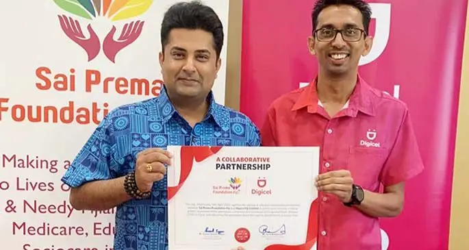Sai Prema Foundation director Sumeet Tappoo with Digicel Fiji chief executive officer, Farid Mohammed.