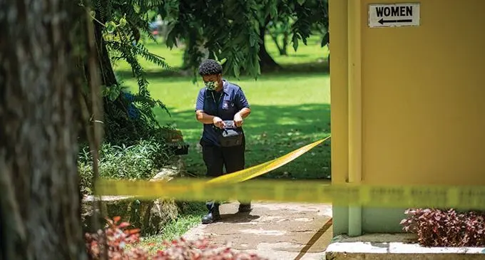 Police forensics personnel at Thurston Garden  after the  body of a female women was found in the public facilities in Suva on November 28 2021. Photo- Leon Lord