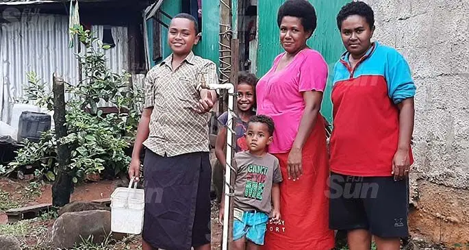 From left: Ilaisa Nalewe, Immanuel Bole, LuisaLeawata, Kelera Adi Luvu and Katarina Nalewe with their buckets next to a tap near their home at the Vatamai Settlement in Lovu, Lautoka. Photo: Salote Qalubau