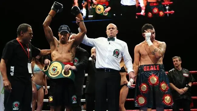 Trainer Lepani Wilson (left) after guiding Renold Quinlan win the IBO world super middleweight title in 2016.